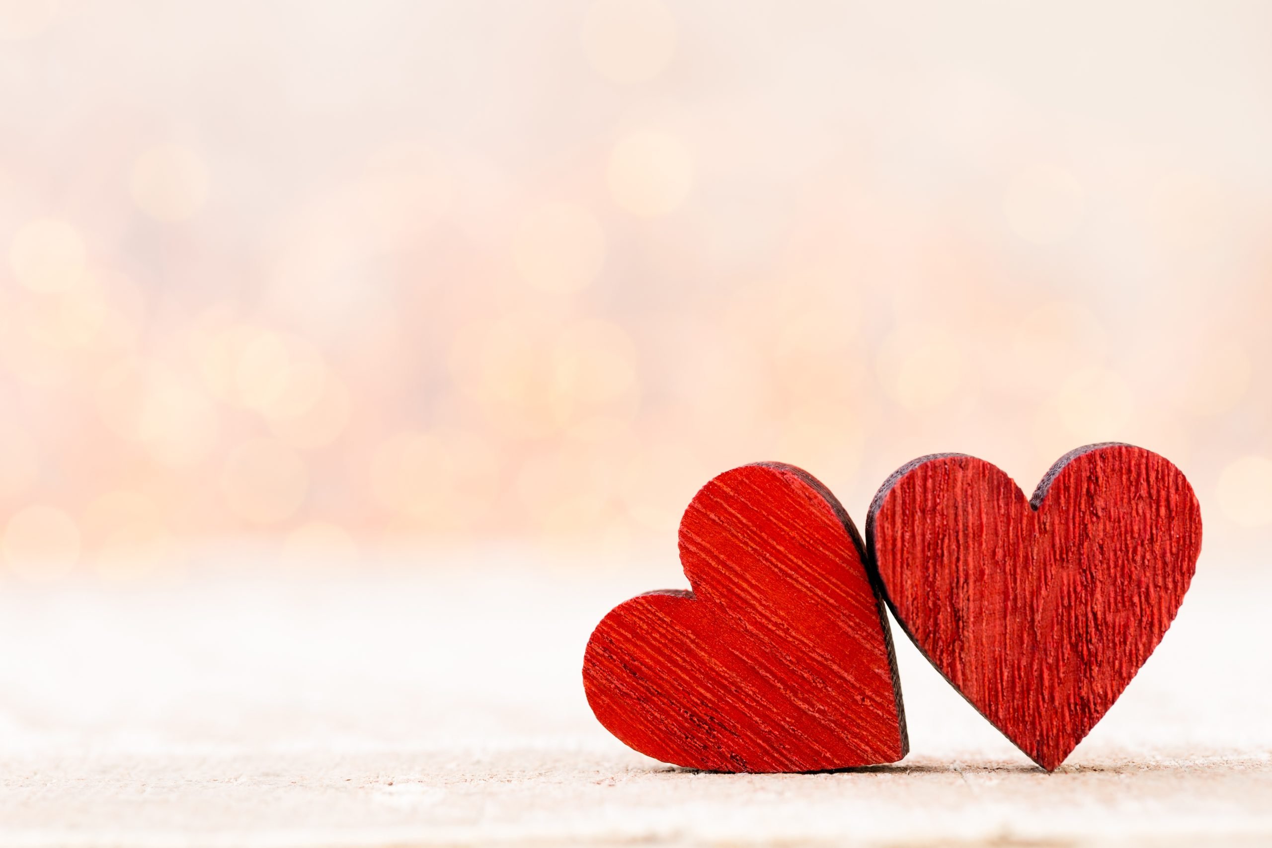 Background with red wooden hearts at the right bottom corner